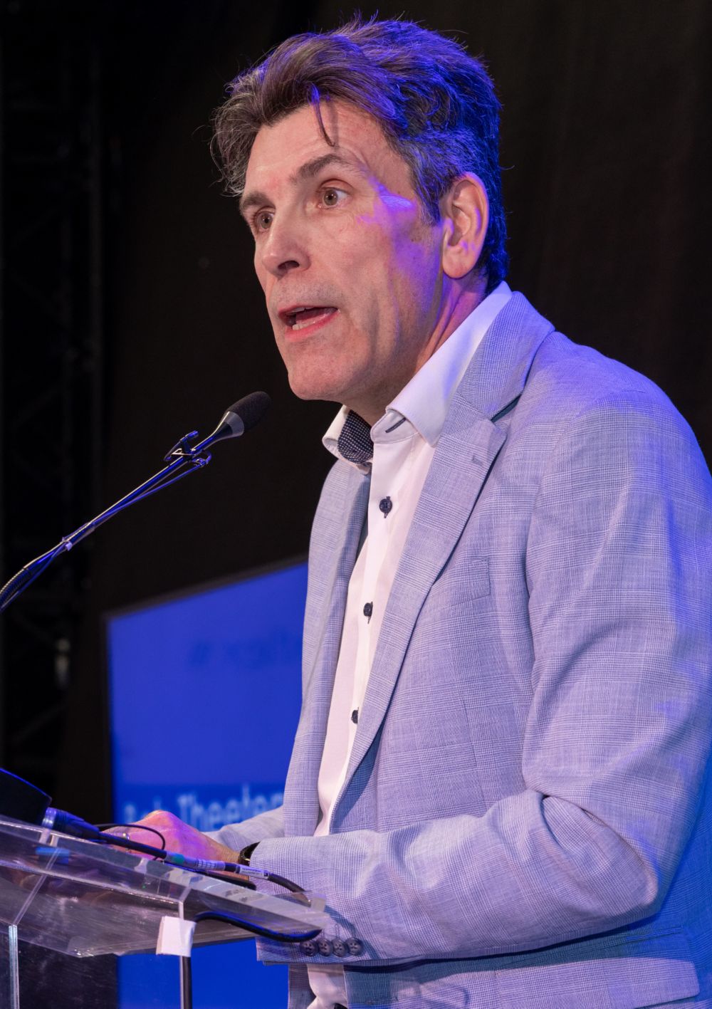 Bob Theeten speaking on the stage 